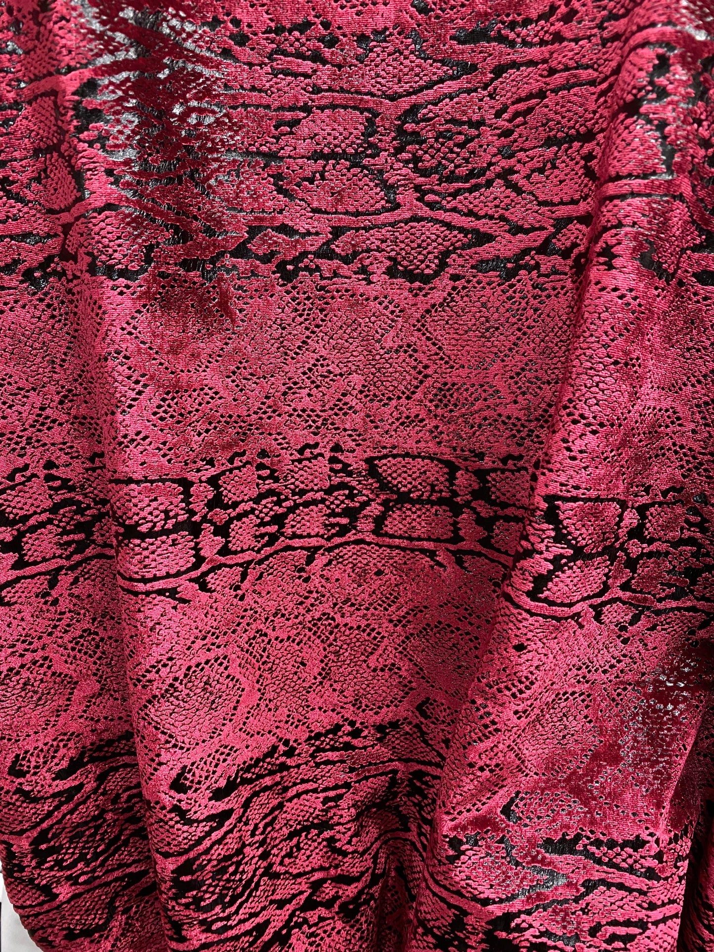 Metallic Stretch velvet snake design burgundy/black 2-way stretch 58/60” Sold by the YD. Ships worldwide from Los Angeles California USA.