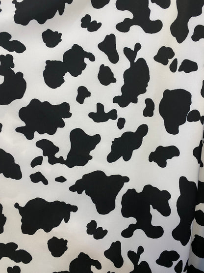 Cow design print on poly spandex 4-way stretch medium weight 58/60” Sold by the YD. Ships worldwide from Los Angeles California USA.