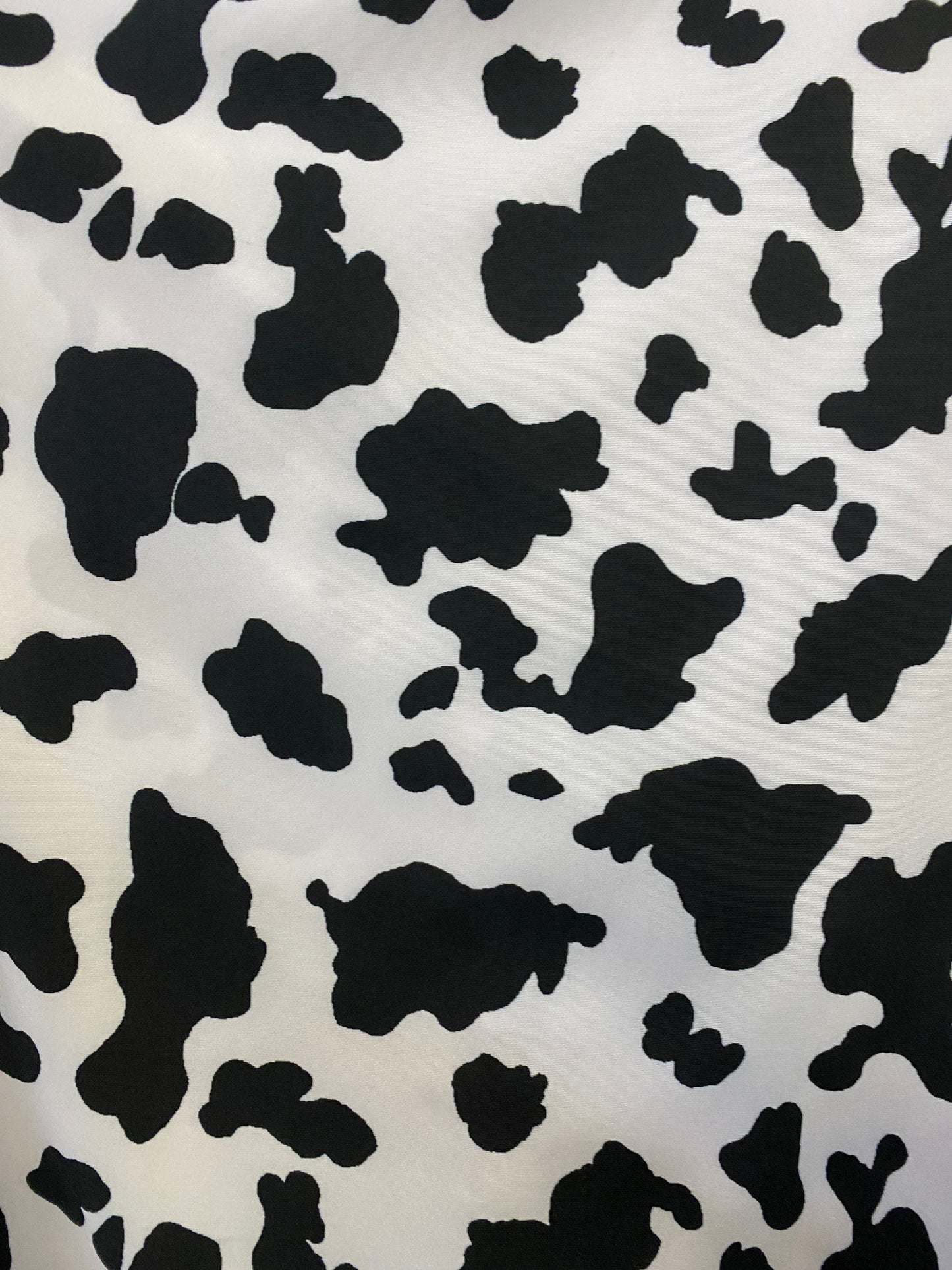 Cow design print on poly spandex 4-way stretch medium weight 58/60” Sold by the YD. Ships worldwide from Los Angeles California USA.