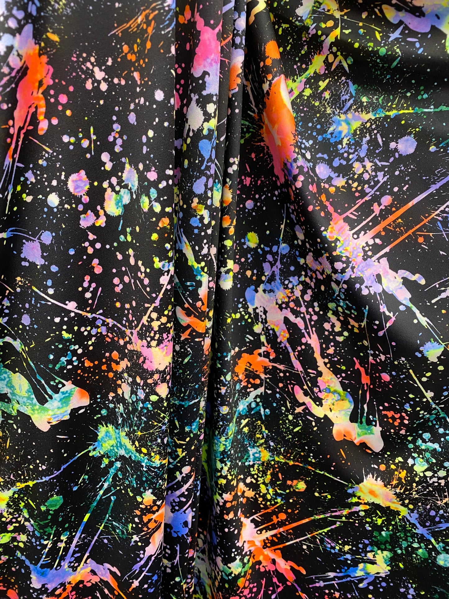 New splatter paint design print on nylon spandex 4-way stretch 58/60” Sold by the YD. Ships worldwide from Los Angeles California USA.