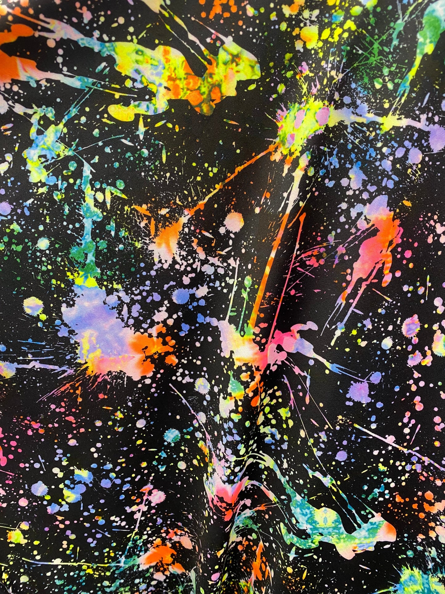 New splatter paint design print on nylon spandex 4-way stretch 58/60” Sold by the YD. Ships worldwide from Los Angeles California USA.