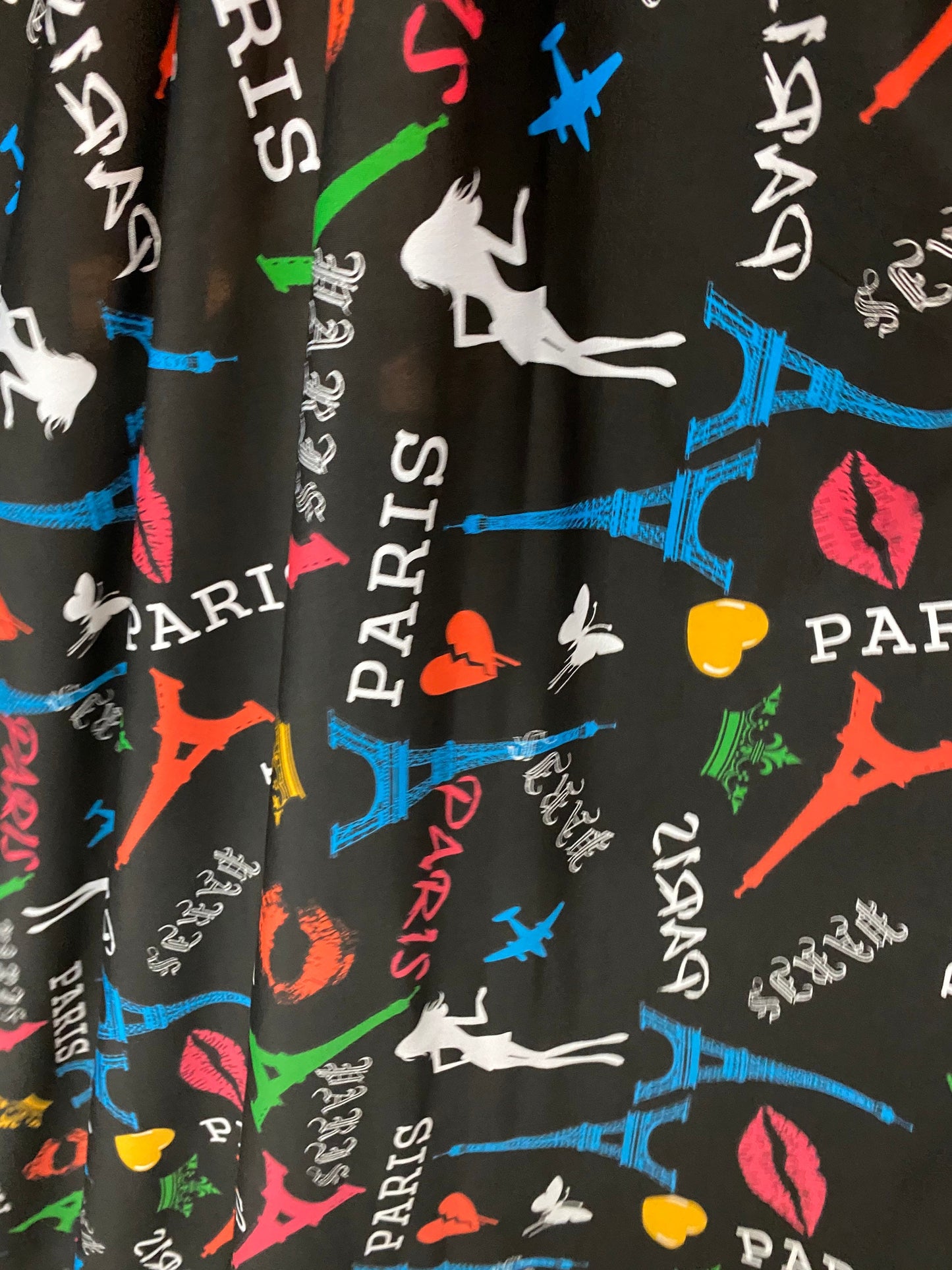 New Poly print spandex Paris design Black/Multicolor 2-way stretch 58/60” Sold by the YD. Ships worldwide from Los Angeles California USA.