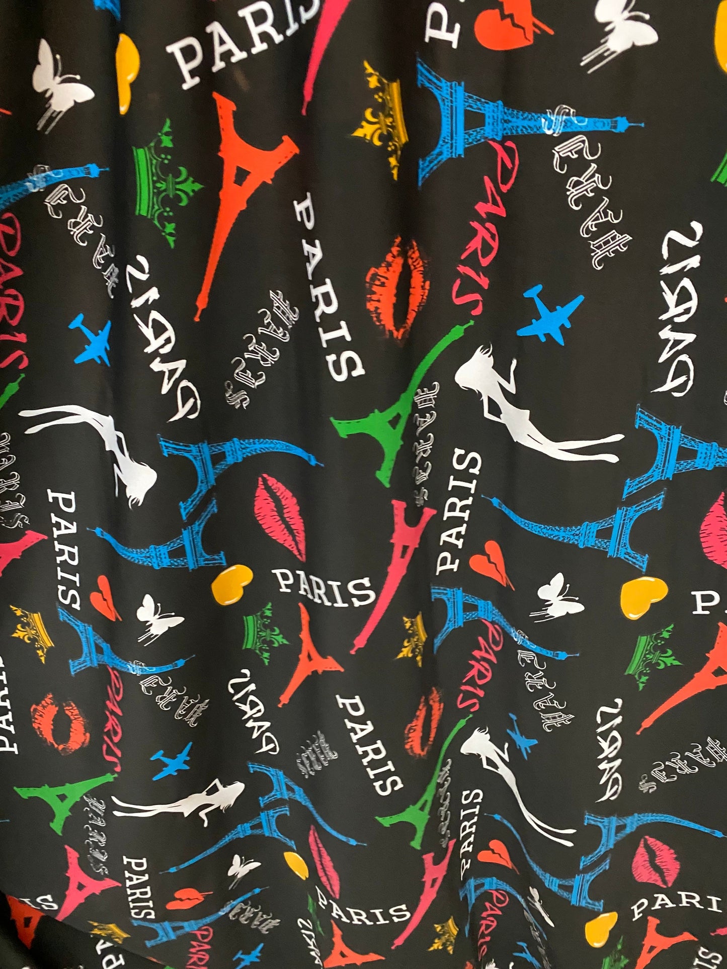 New Poly print spandex Paris design Black/Multicolor 2-way stretch 58/60” Sold by the YD. Ships worldwide from Los Angeles California USA.