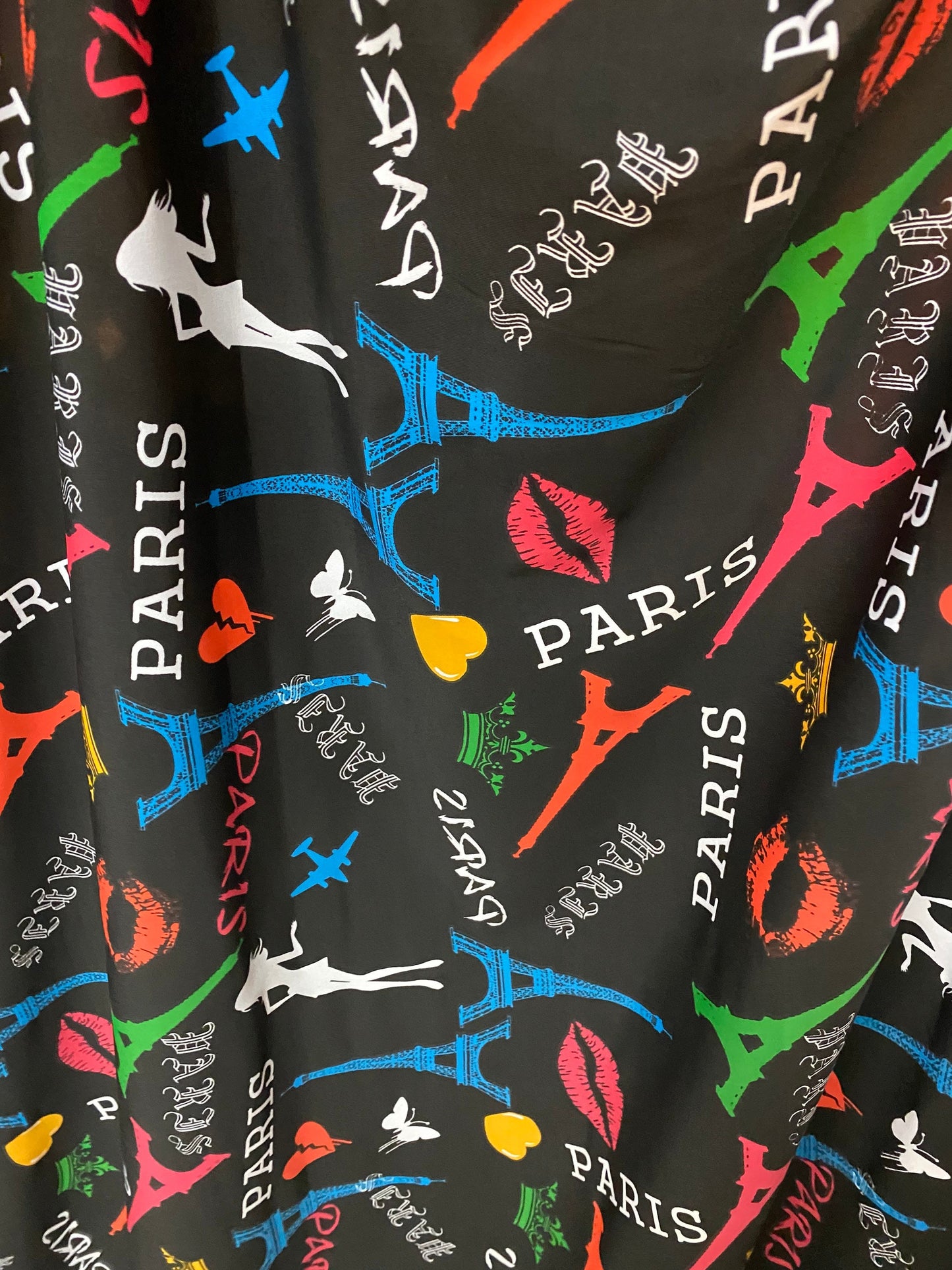 New Poly print spandex Paris design Black/Multicolor 2-way stretch 58/60” Sold by the YD. Ships worldwide from Los Angeles California USA.