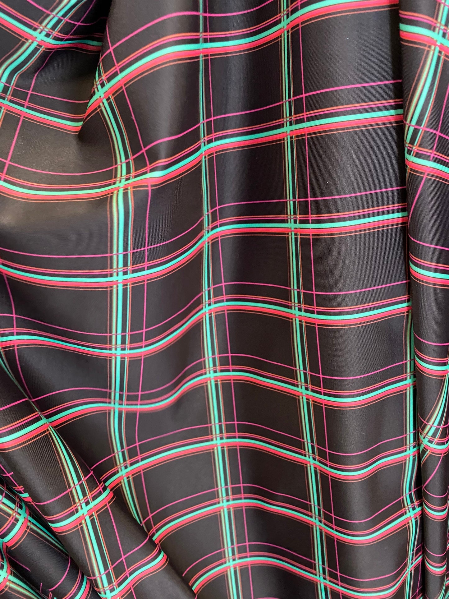 New plaid design black/multi print nylon spandex 4-way stretch 58/60” Sold by the YD. Ships worldwide from Los Angeles California USA.