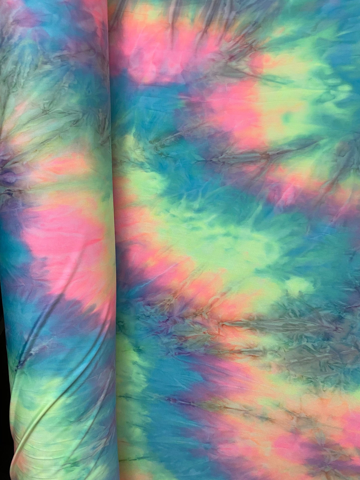 New tie dye poly spandex pastel colors 2-way stretch medium weight 58/60” Sold by the YD. Ships worldwide from Los Angeles California USA.