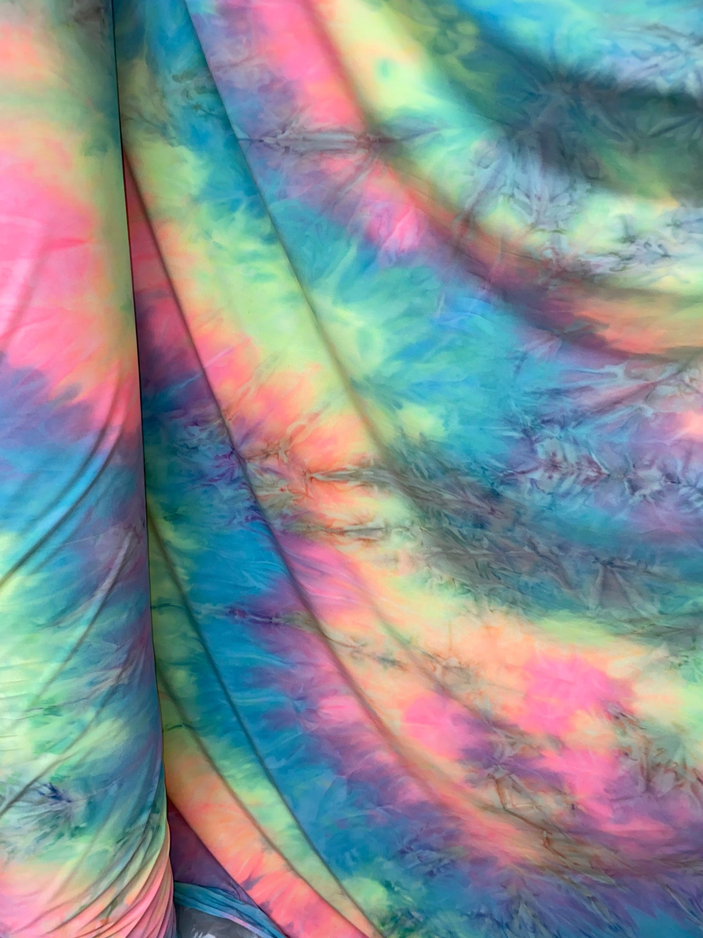 New tie dye poly spandex pastel colors 2-way stretch medium weight 58/60” Sold by the YD. Ships worldwide from Los Angeles California USA.