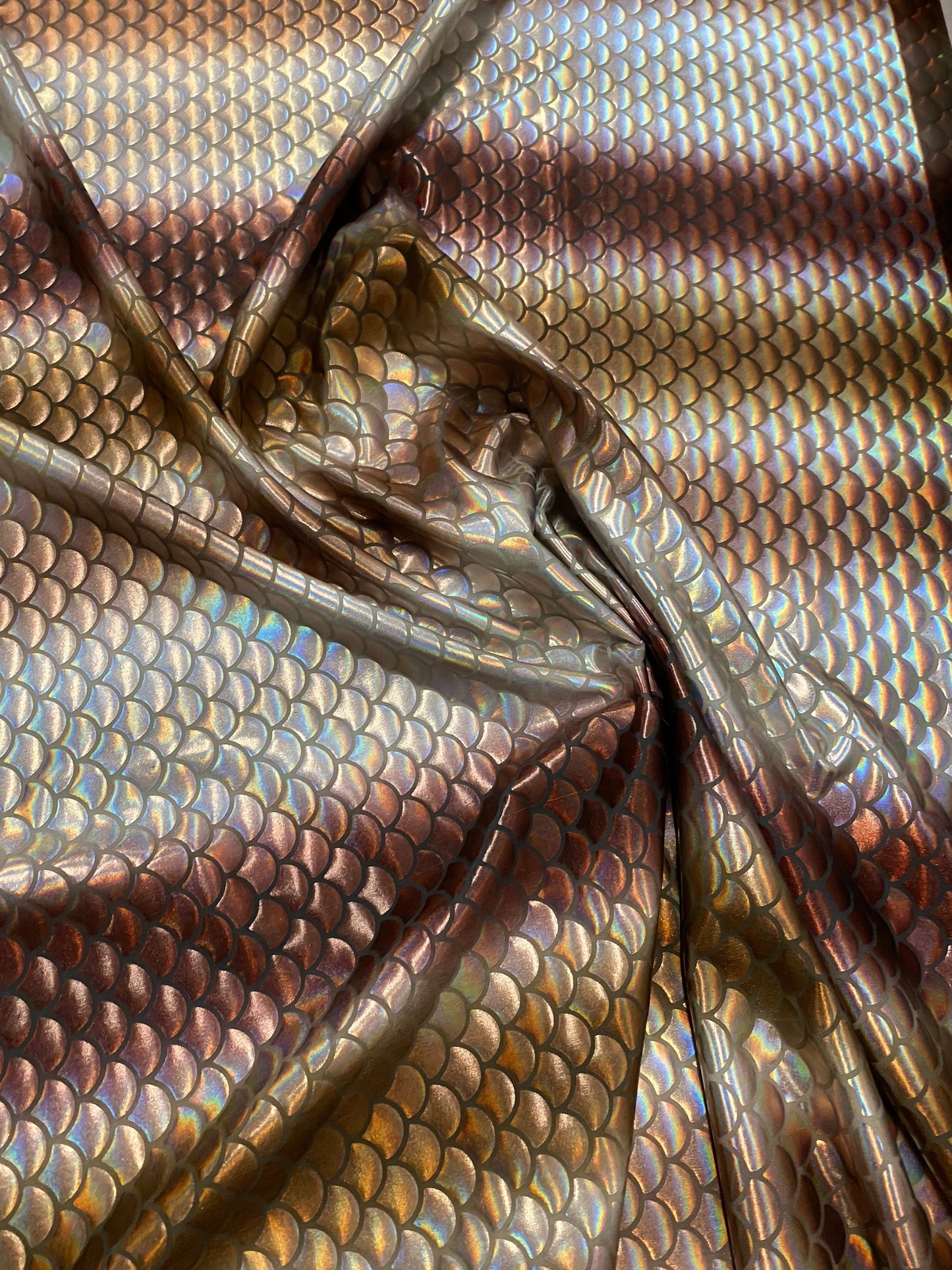 New Rainbow mermaid design brown/silver iridescent metallic nylon spandex 4-way stretch 58/60” Sold by the YD. Ships worldwide from L.A CA.