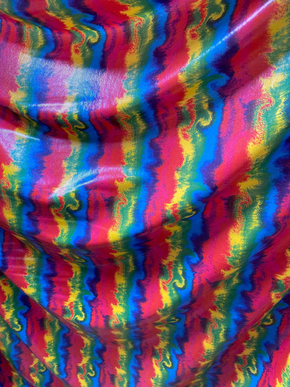 New Lava design rainbow color print nylon spandex with clear foggy foil all over 4-way stretch 58/60” Sold by the YD.