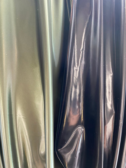 New Iridescent reflectiveTPU vinyl coated 4-way stretch poly spandex 58/60” Sold by the YD. Ships worldwide from Los Angeles California USA.