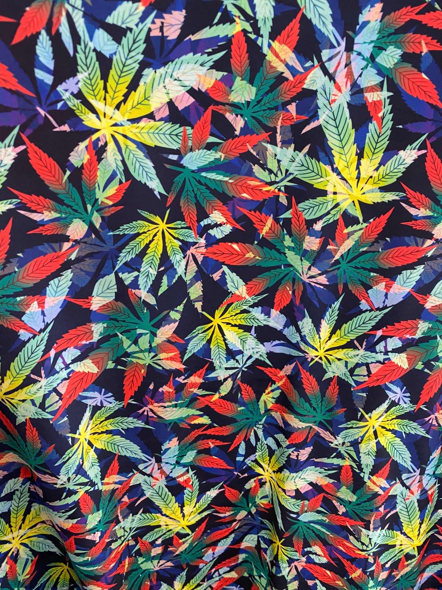 Marijuana cannabis leaf design print on nylon spandex 4way stretch 58/60” Sold by the YD. Ships worldwide from Los Angeles California USA.