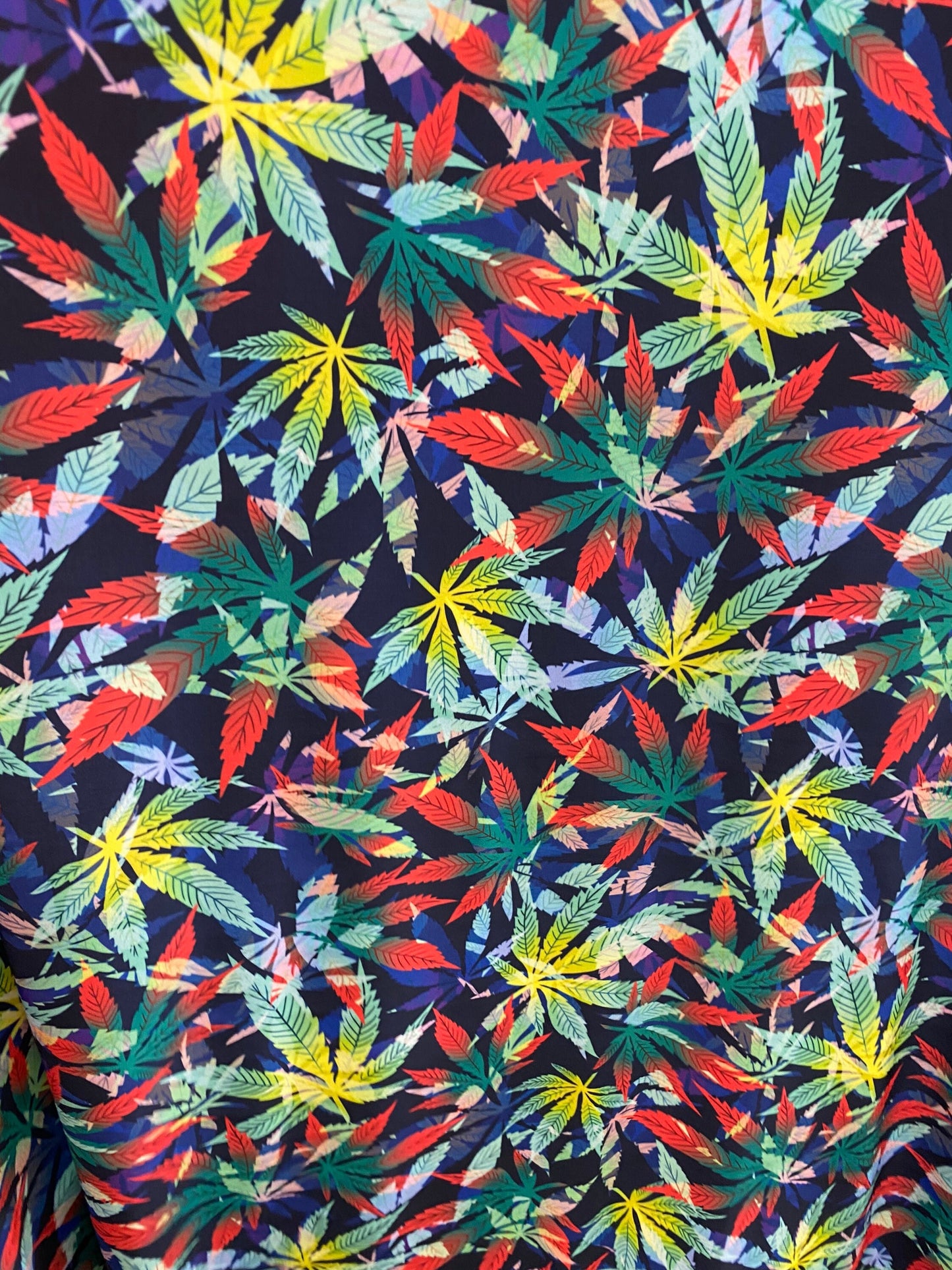 Marijuana cannabis leaf design print on nylon spandex 4way stretch 58/60” Sold by the YD. Ships worldwide from Los Angeles California USA.