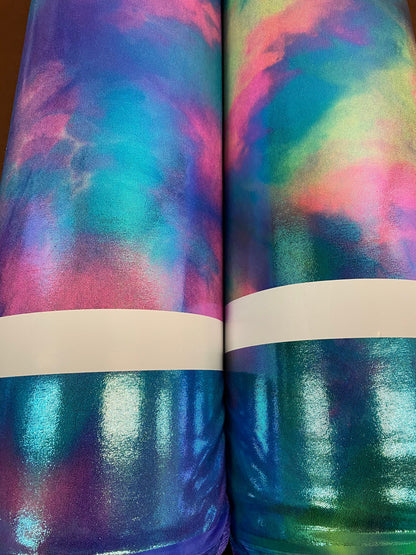 New cotton candy and multi pastel tie dye metallic nylon spandex with foggy foil 4-way stretch 58/60” Sold by the YD.