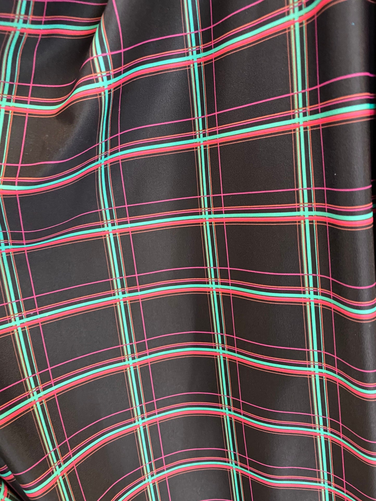 New plaid design black/multi print nylon spandex 4-way stretch 58/60” Sold by the YD. Ships worldwide from Los Angeles California USA.