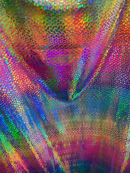 New stone design iridescent sequins on rainbow nylon spandex 4-way stretch 58/60” Sold by the YD. Ships worldwide from Los Angeles CA USA.