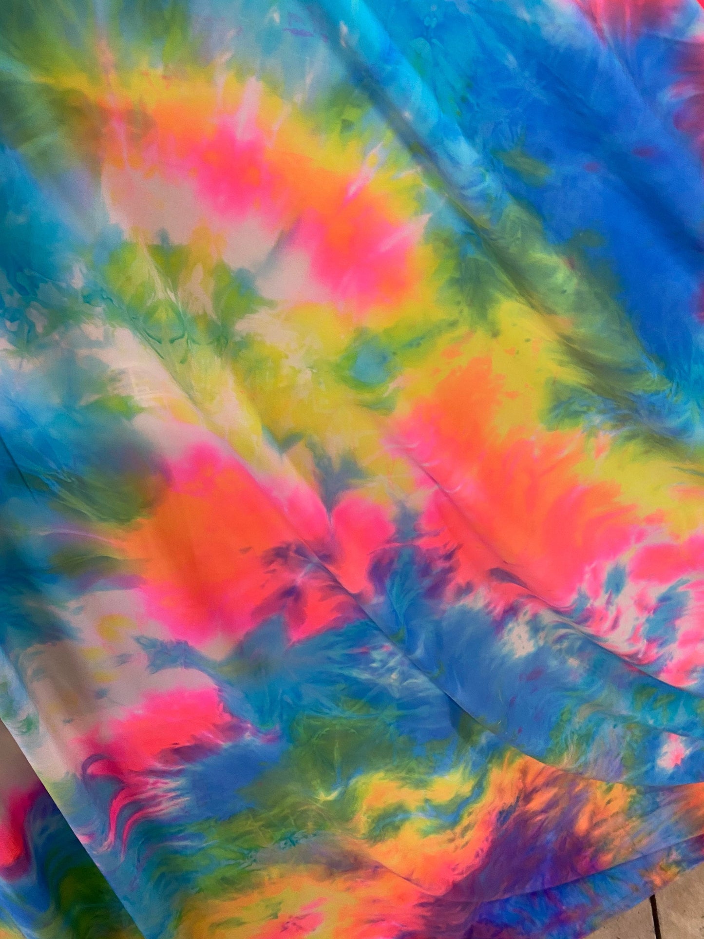 Rainbow tie dye great quality nylon spandex 4-way stretch 58/60” Sold by the YD. Ships worldwide from Los Angeles California USA.