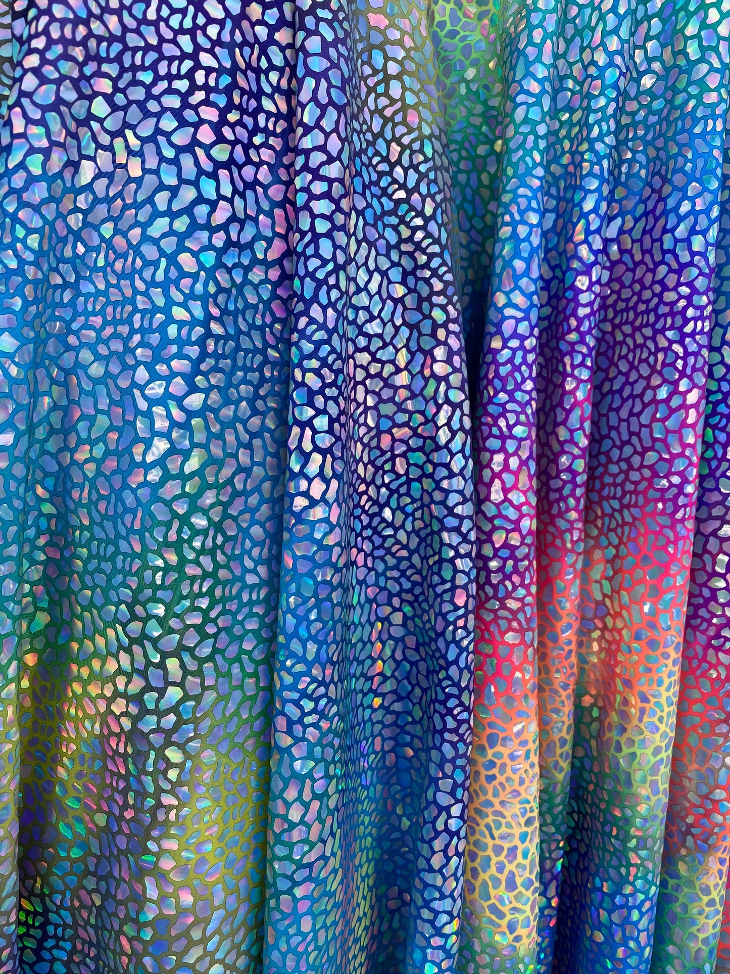 Dinosaur reptile skin design iridescent sequins on rainbow nylon spandex 4-way stretch 58/60” Sold by the YD. Ships worldwide from L.A CA