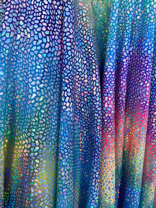 Dinosaur reptile skin design iridescent sequins on rainbow nylon spandex 4-way stretch 58/60” Sold by the YD. Ships worldwide from L.A CA