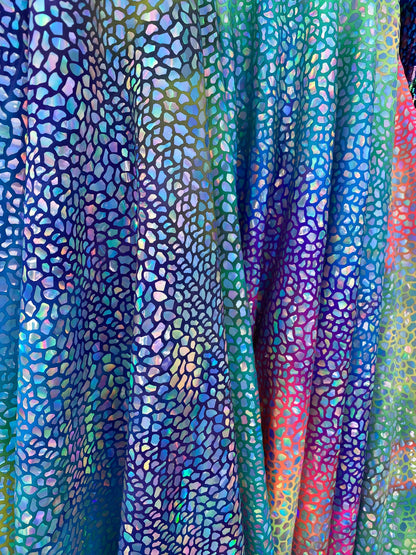 Dinosaur reptile skin design iridescent sequins on rainbow nylon spandex 4-way stretch 58/60” Sold by the YD. Ships worldwide from L.A CA