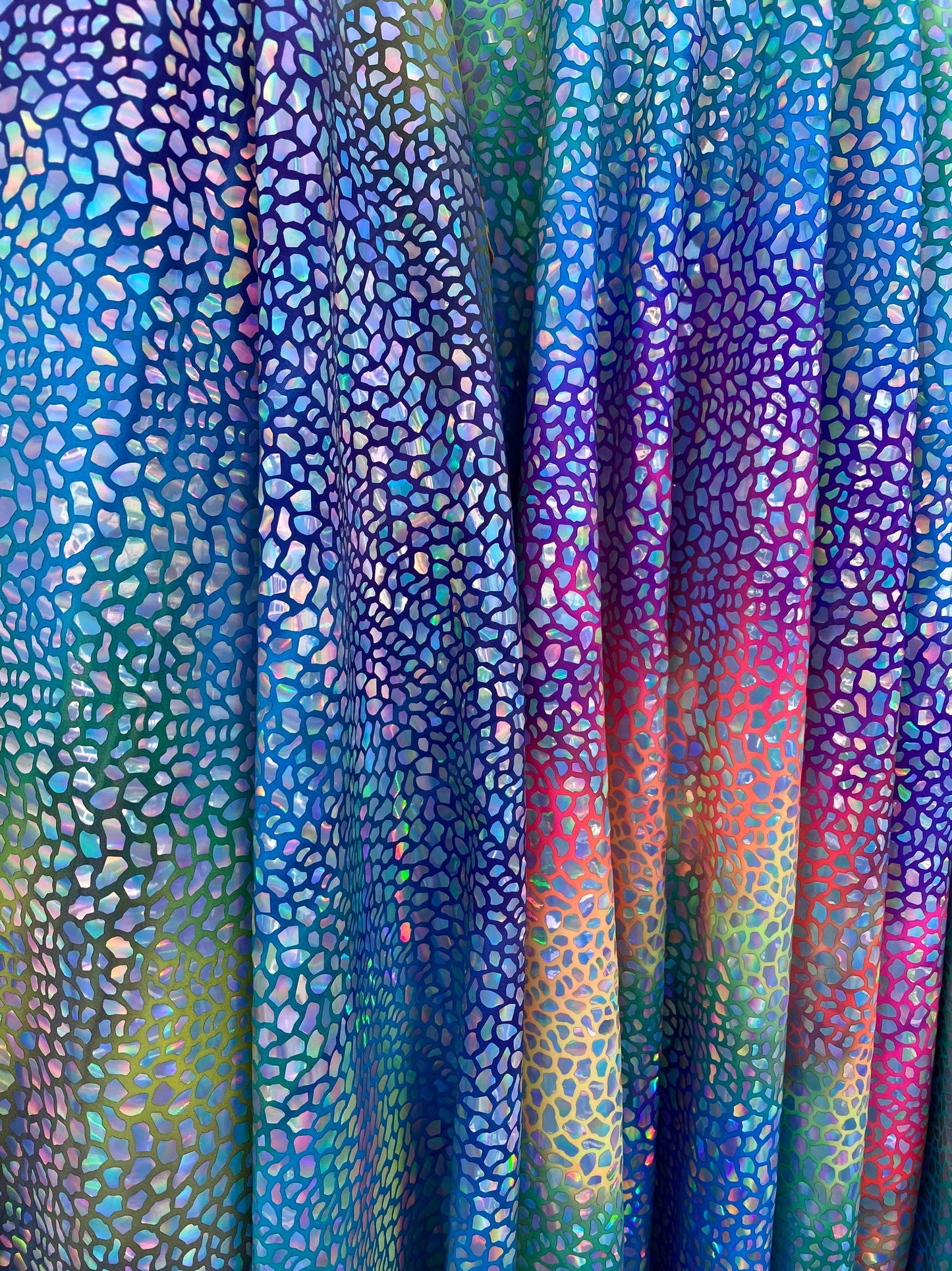 Dinosaur reptile skin design iridescent sequins on rainbow nylon spandex 4-way stretch 58/60” Sold by the YD. Ships worldwide from L.A CA