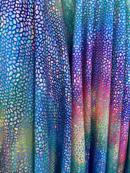 Dinosaur reptile skin design iridescent sequins on rainbow nylon spandex 4-way stretch 58/60” Sold by the YD. Ships worldwide from L.A CA