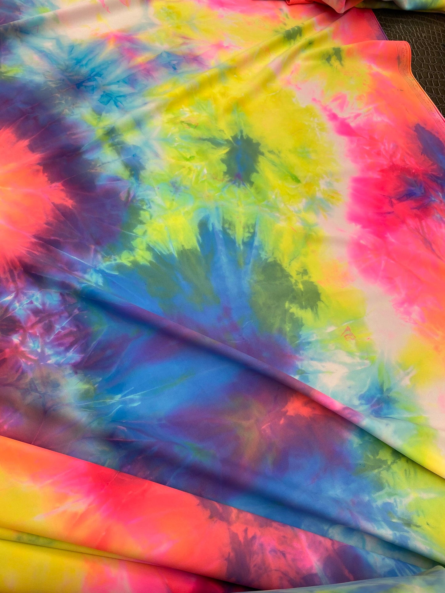 Great quality of tie dye nylon spandex 4-way stretch multicolor 58/60” Sold by the YD. Ships worldwide from Los Angeles California USA.