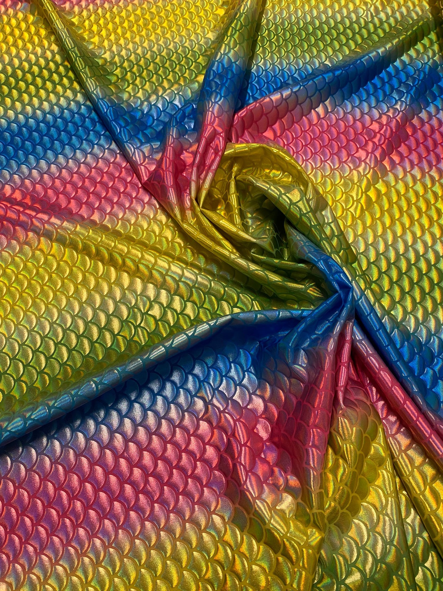 New Rainbow mermaid design Iridescent metallic nylon spandex 4-way stretch 58/60” Sold by the YD. Ships worldwide from Los Angeles CA USA.