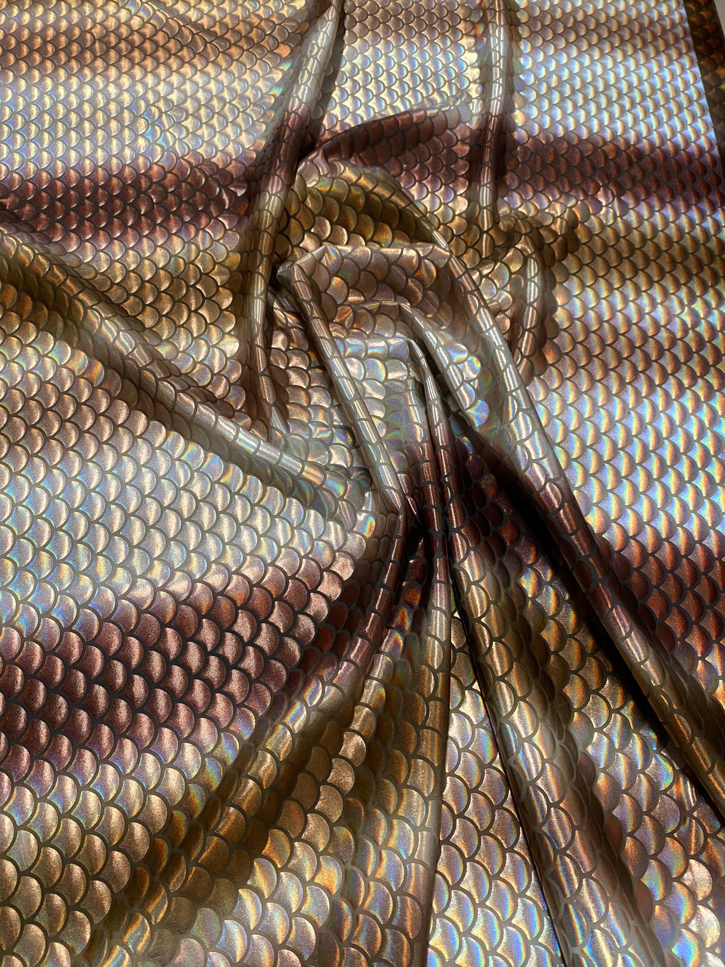 New Rainbow mermaid design brown/silver iridescent metallic nylon spandex 4-way stretch 58/60” Sold by the YD. Ships worldwide from L.A CA.