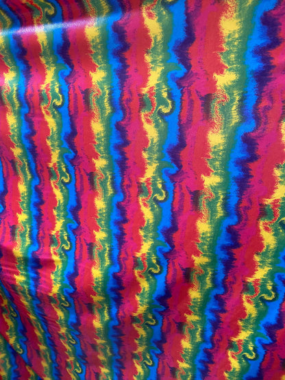 New Lava design rainbow color print nylon spandex with clear foggy foil all over 4-way stretch 58/60” Sold by the YD.