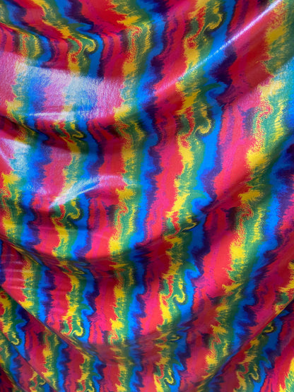 New Lava design rainbow color print nylon spandex with clear foggy foil all over 4-way stretch 58/60” Sold by the YD.