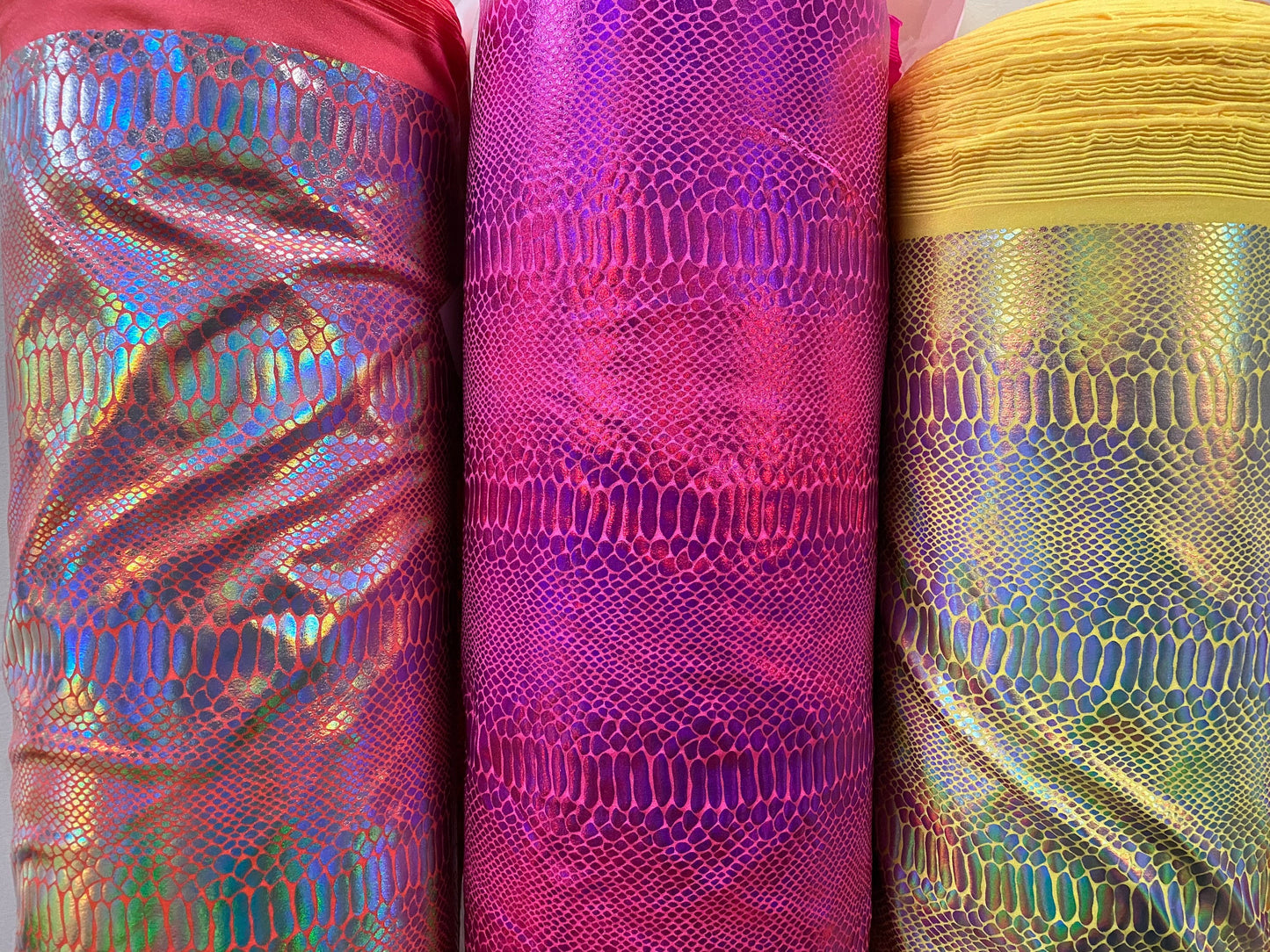 Ilusión Anaconda design crystal iridescent foil on nylon spandex 4-way stretch 58/60” Sold by the YD. Ships worldwide from Los Angeles CA.