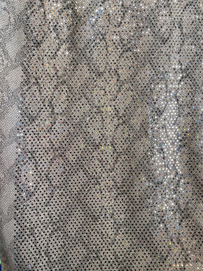 New metallic spandex snake design  blush color with sequins all over 58/60” Sold by the YD. Ships worldwide from Los Angeles California USA.