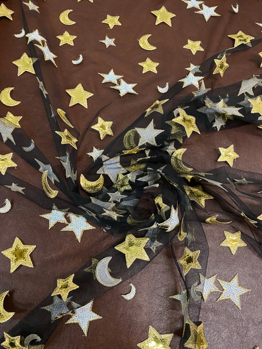 New stars and moons design shining gold vinyl in black poly mesh 2-way stretch 58/60” Sold by the YD. Ships worldwide from Los Angeles CA.