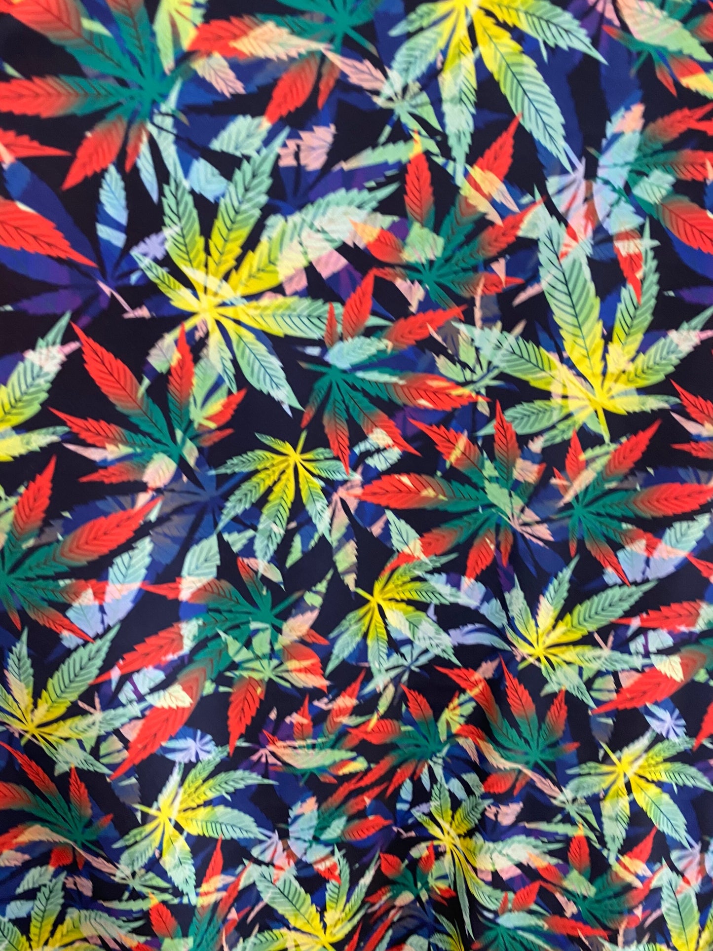 Marijuana cannabis leaf design print on nylon spandex 4way stretch 58/60” Sold by the YD. Ships worldwide from Los Angeles California USA.