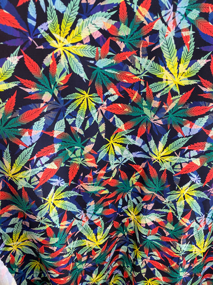 Marijuana cannabis leaf design print on nylon spandex 4way stretch 58/60” Sold by the YD. Ships worldwide from Los Angeles California USA.