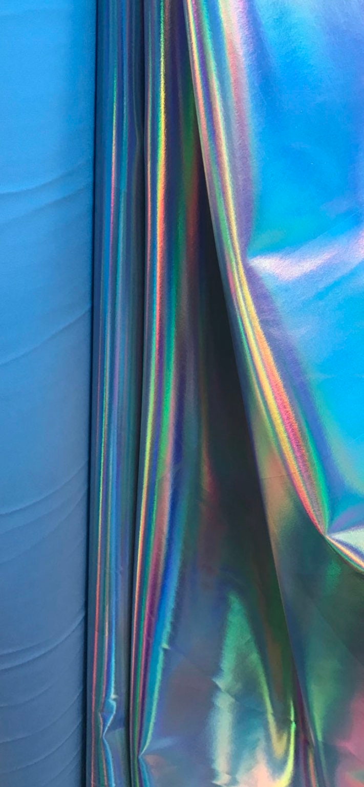 Great quality iridescent white/silver all over foil on spandex fabric shinny metallic nylon spandex 4-way stretch 58/60” Sold by the YD.