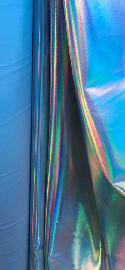 Great quality iridescent white/silver all over foil on spandex fabric shinny metallic nylon spandex 4-way stretch 58/60” Sold by the YD.