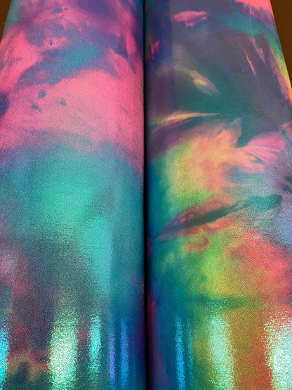 New cotton candy and multi pastel tie dye metallic nylon spandex with foggy foil 4-way stretch 58/60” Sold by the YD.