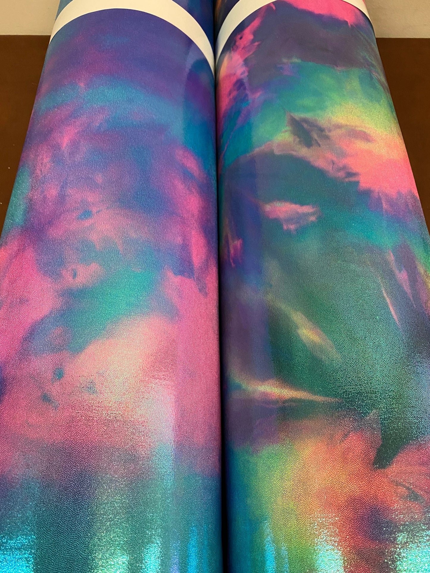 New cotton candy and multi pastel tie dye metallic nylon spandex with foggy foil 4-way stretch 58/60” Sold by the YD.