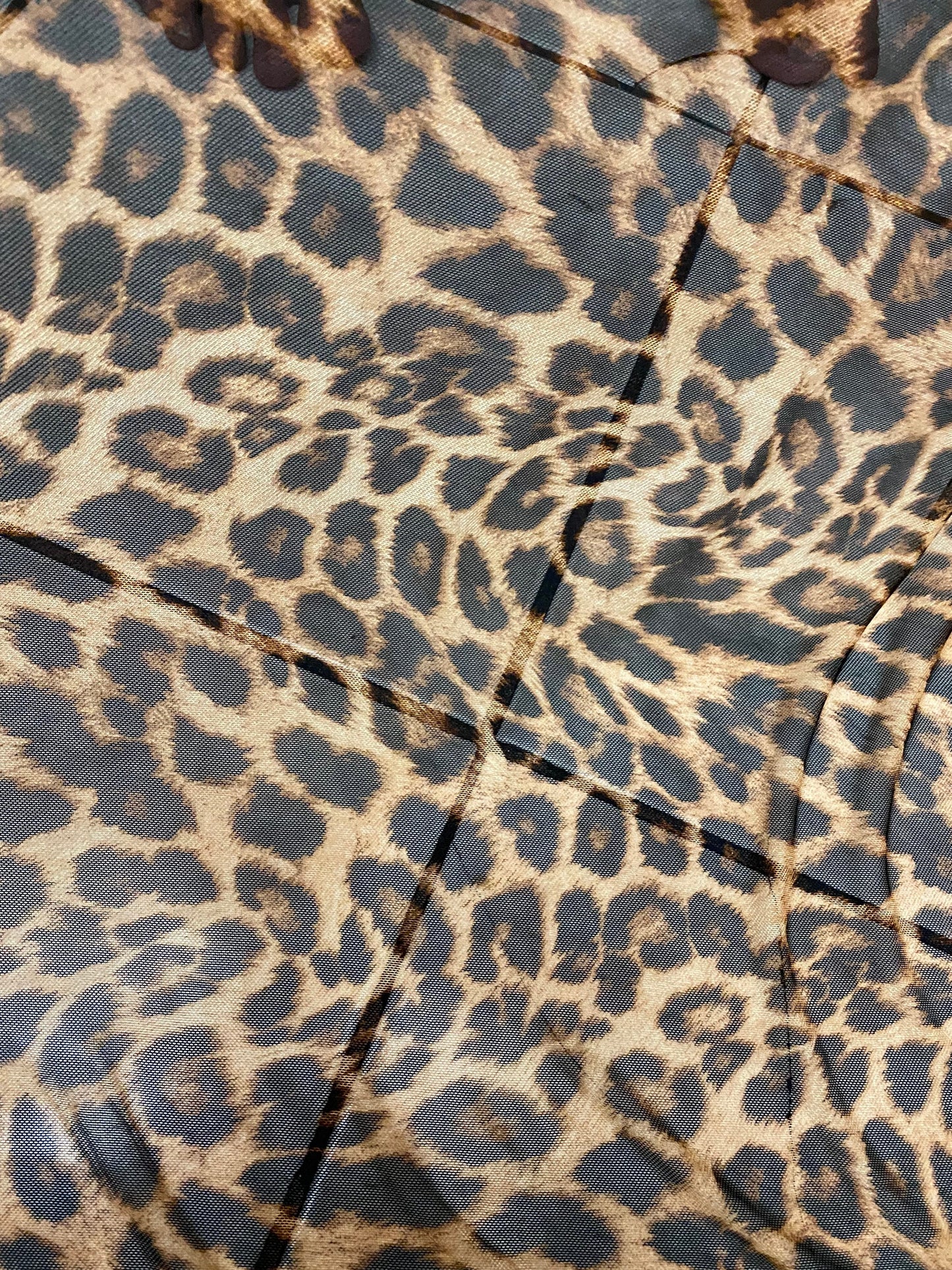 New exotic leopard design print on power mesh 4-way stretch 58/60” Sold by the YD. Ships worldwide from Los Angeles California USA.