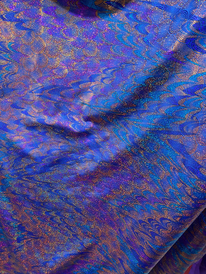 New peacock design hologram sapphire hologram metallic nylon spandex 4-way stretch 58/60” Sold by the YD. Ships worldwide from Los Angeles