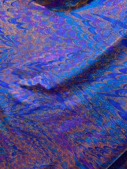 New peacock design hologram sapphire hologram metallic nylon spandex 4-way stretch 58/60” Sold by the YD. Ships worldwide from Los Angeles