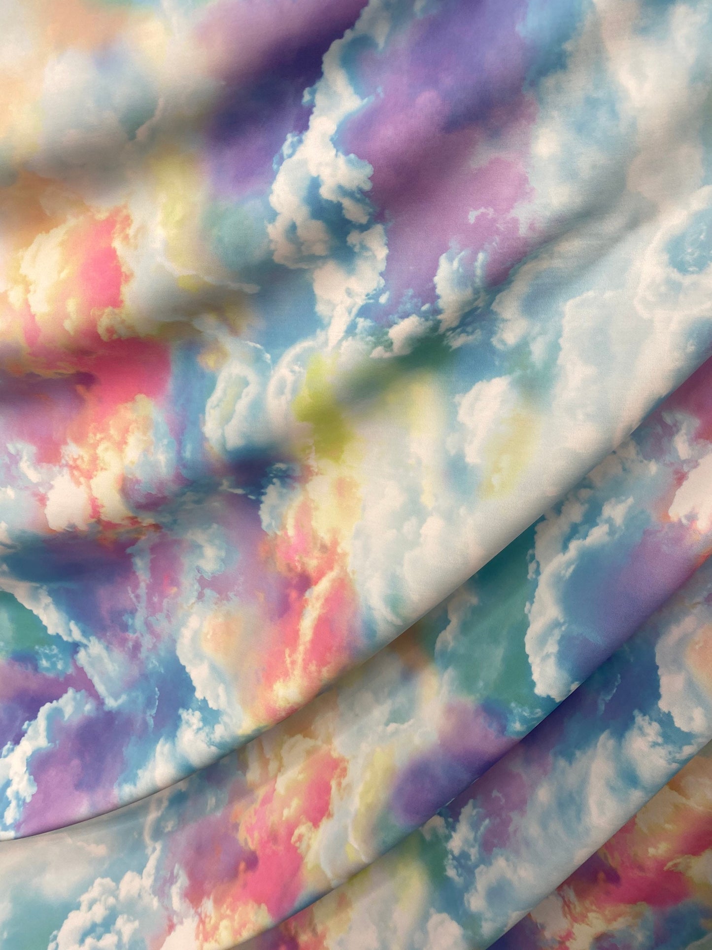 New clouds design  print on nylon spandex 4way Stretch blue multicolor 58/60" Sold by the yd. Ships worldwide from Los Angeles California US