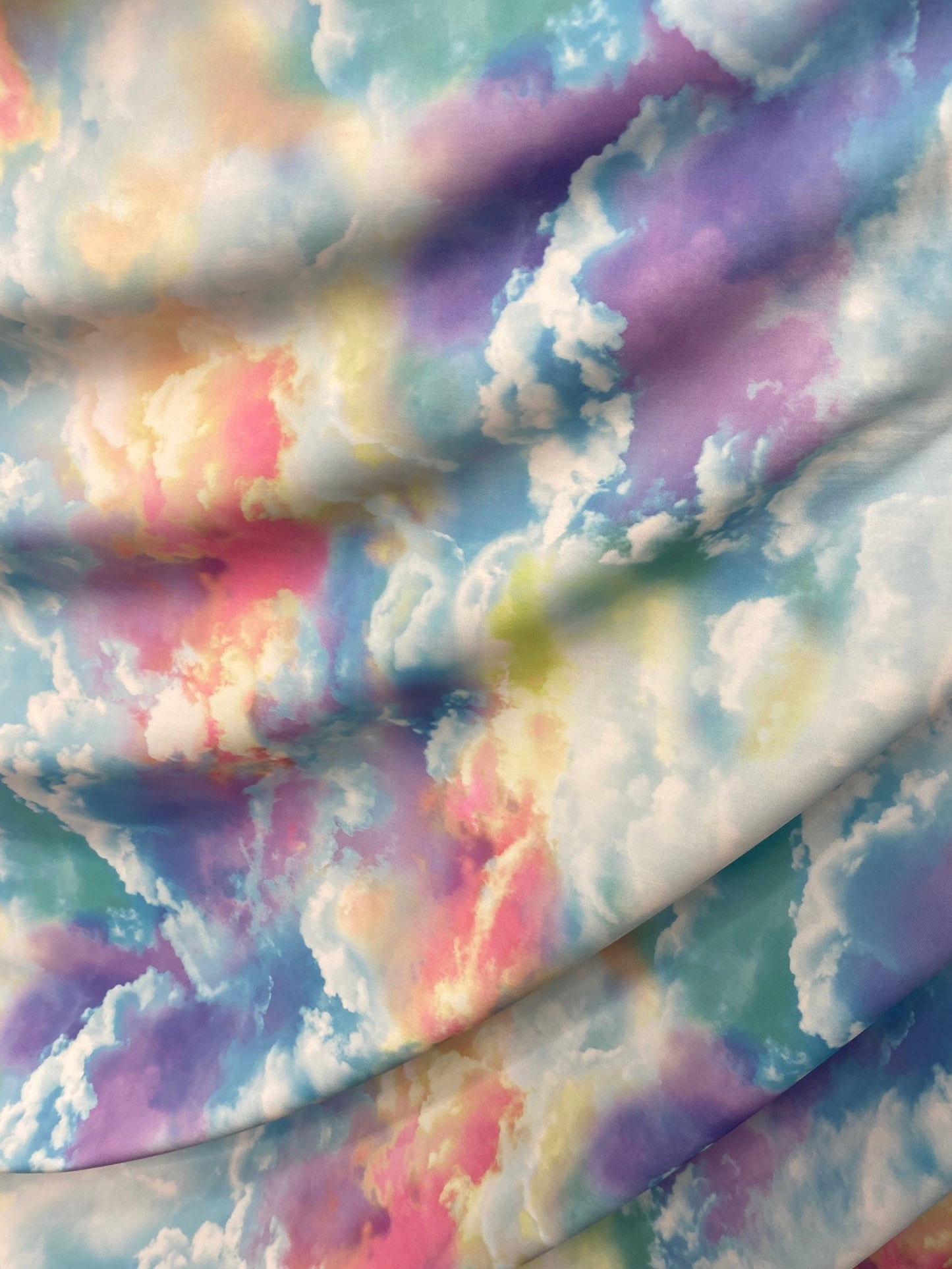 New clouds design  print on nylon spandex 4way Stretch blue multicolor 58/60" Sold by the yd. Ships worldwide from Los Angeles California US