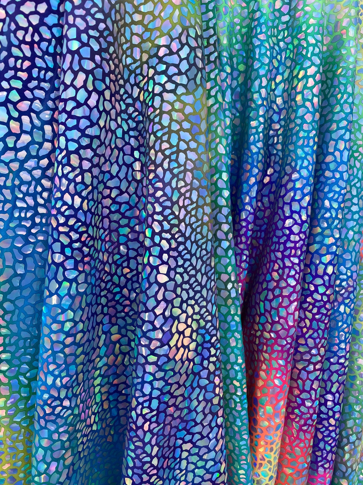 Dinosaur reptile skin design iridescent sequins on rainbow nylon spandex 4-way stretch 58/60” Sold by the YD. Ships worldwide from L.A CA