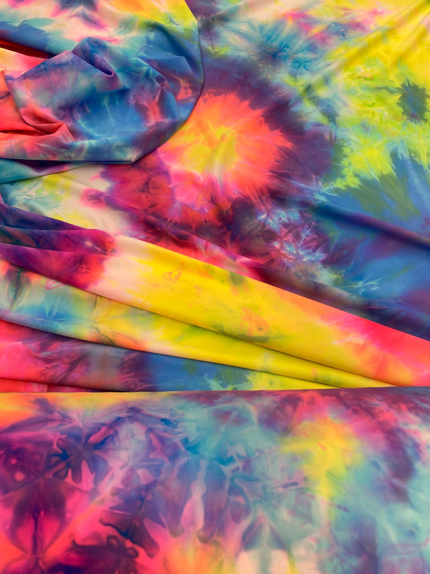 Great quality of tie dye nylon spandex 4-way stretch multicolor 58/60” Sold by the YD. Ships worldwide from Los Angeles California USA.