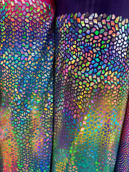 New Dragon scales Iridescent foil on Great tie dye nylon spandex 4-way stretch 58/60” Sold by the YD. New fabric in stock.