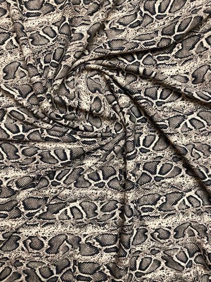 New Exotic snake design taupe/black print on great poly spandex 2-way stretch 58/60” Sold by the YD. Ships worldwide from Los Angeles CA.