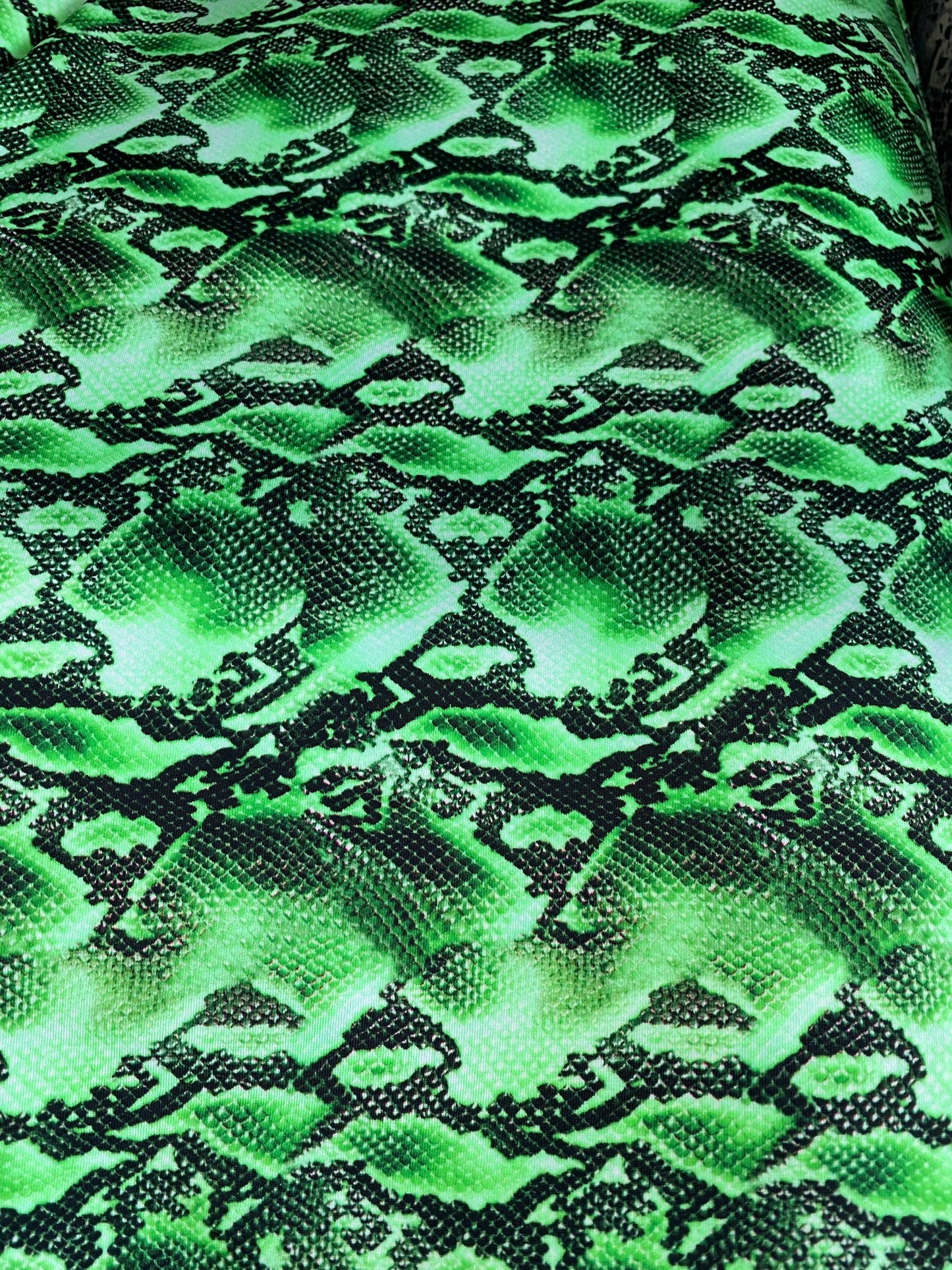 New venom snake design green/black print on best quality of nylon spandex 4-way stretch 58/60” Sold by the YD. Ships worldwide from L.A CA