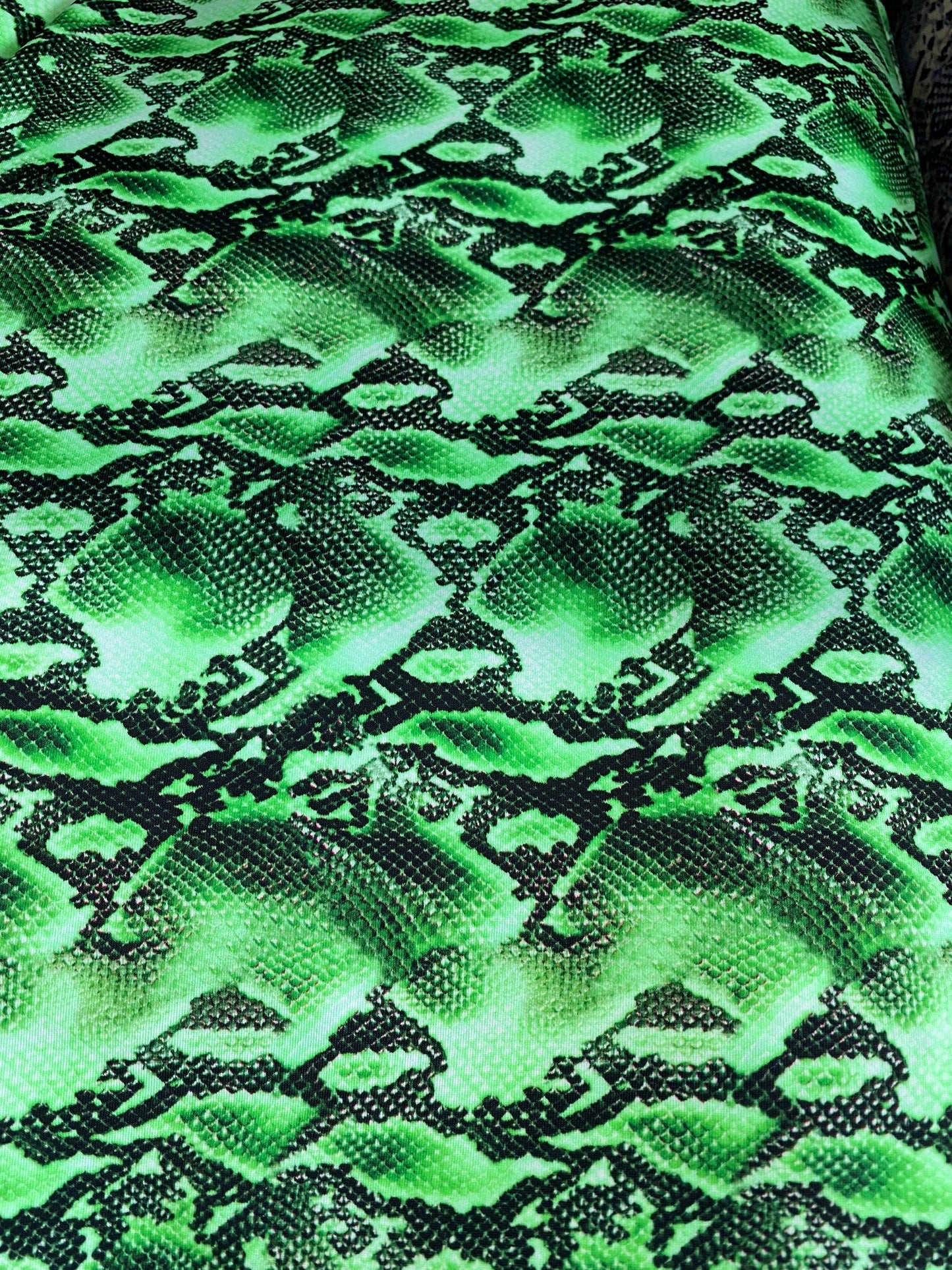 New venom snake design green/black print on best quality of nylon spandex 4-way stretch 58/60” Sold by the YD. Ships worldwide from L.A CA